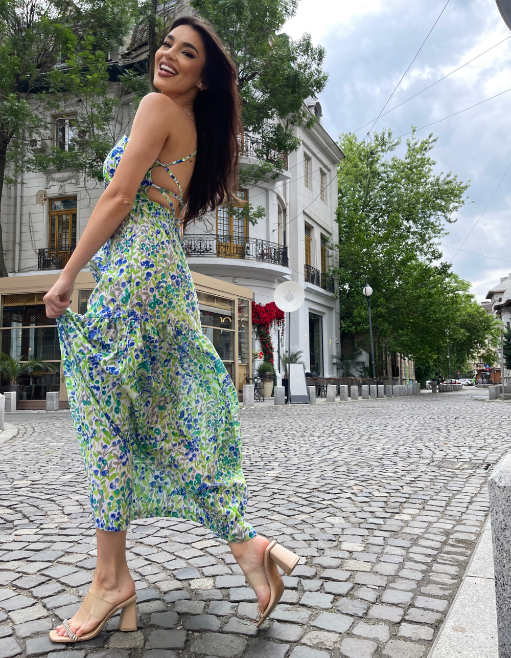 girl smiling and wearing an open back apron dress pattern