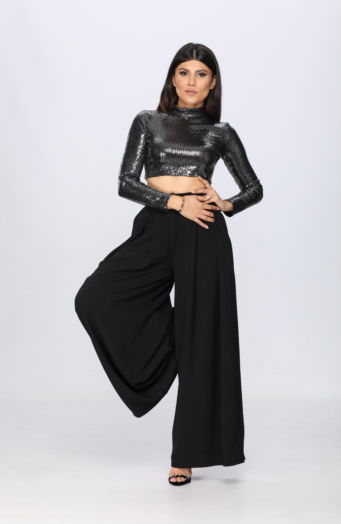 woman posing in a diy sewn pants pattern