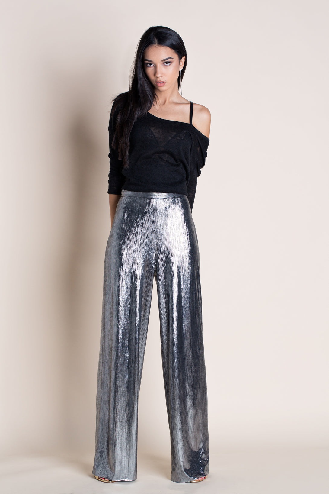 woman wearing a silver high waist pants pattern