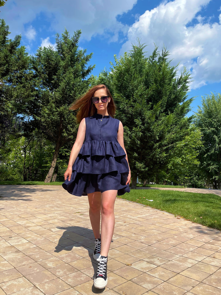 woman posing in a summer tiered dress pattern