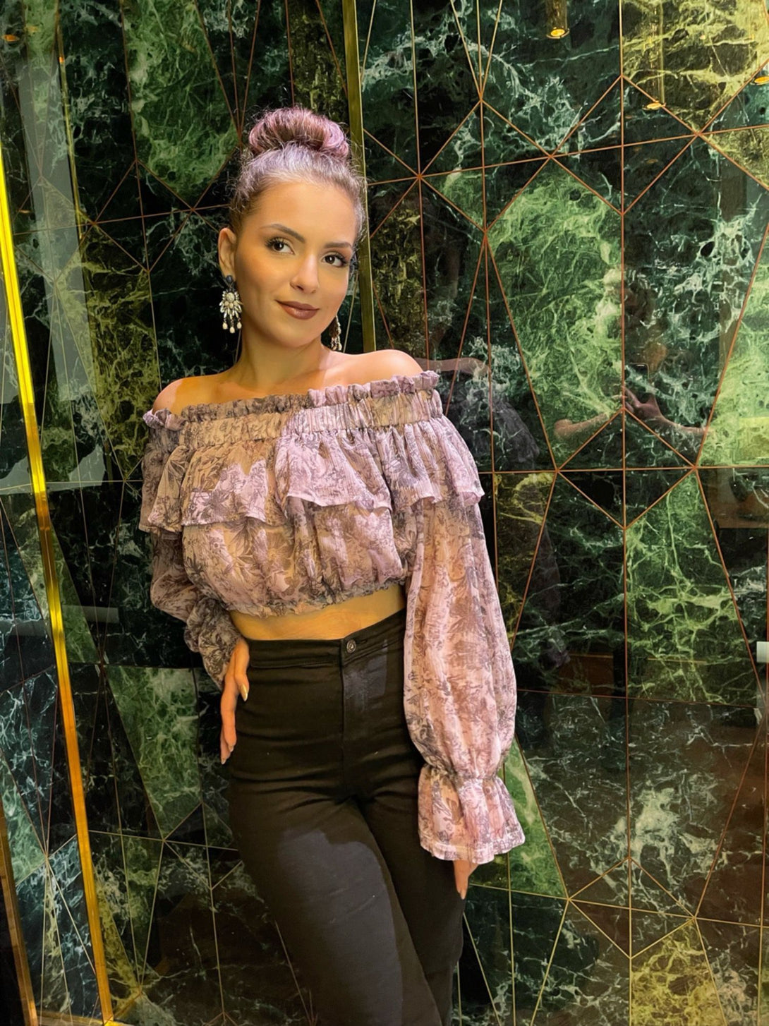 woman posing in a diy sewn crop top pattern and a pair of jeans