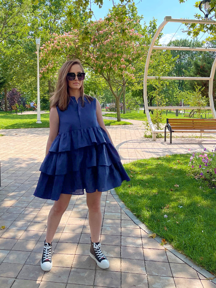 woman wearing a blue loose tiered dress