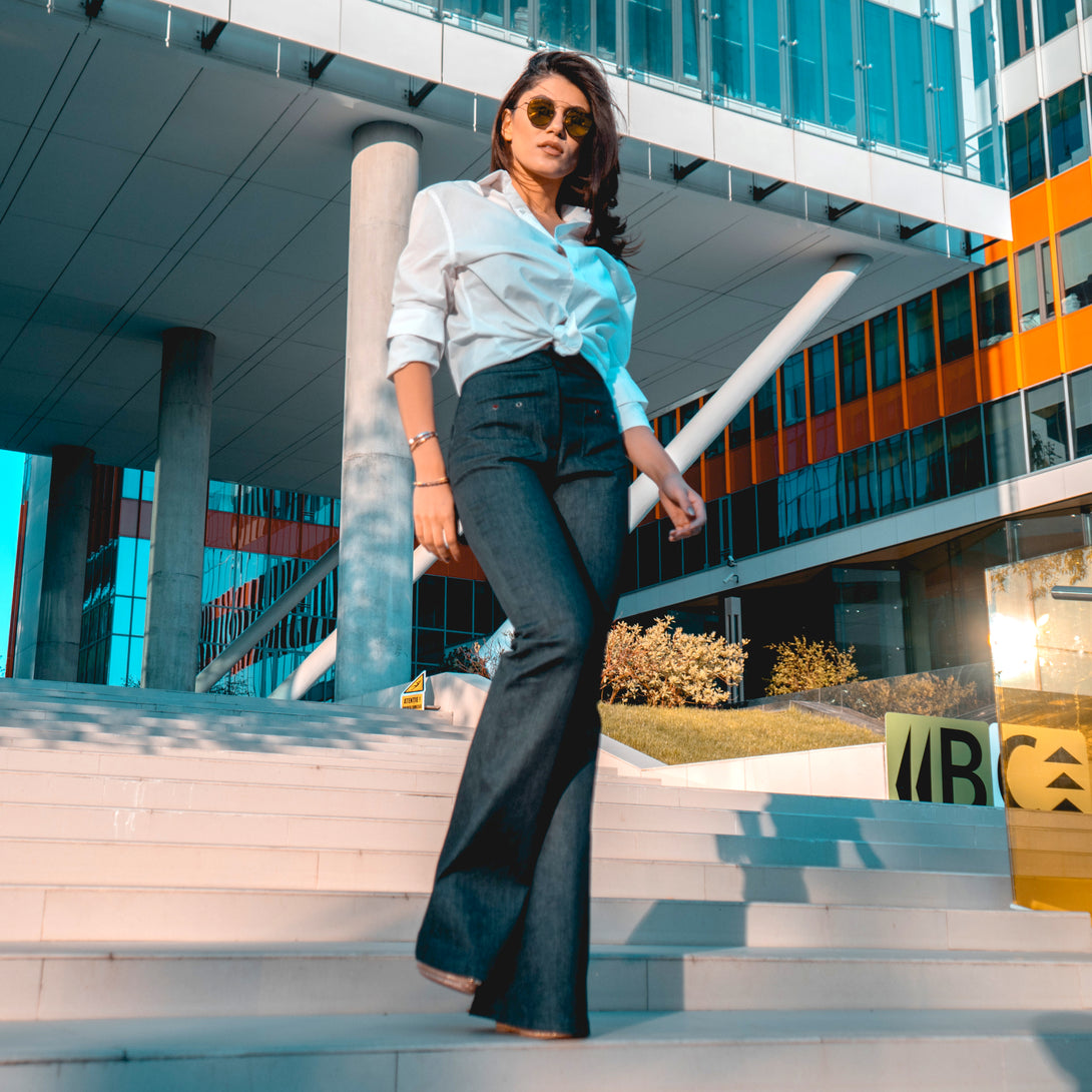 woman on a building stairs wearing a pair of diy sewn jeans pattern