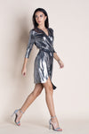 woman wearing a metallic wrap dress